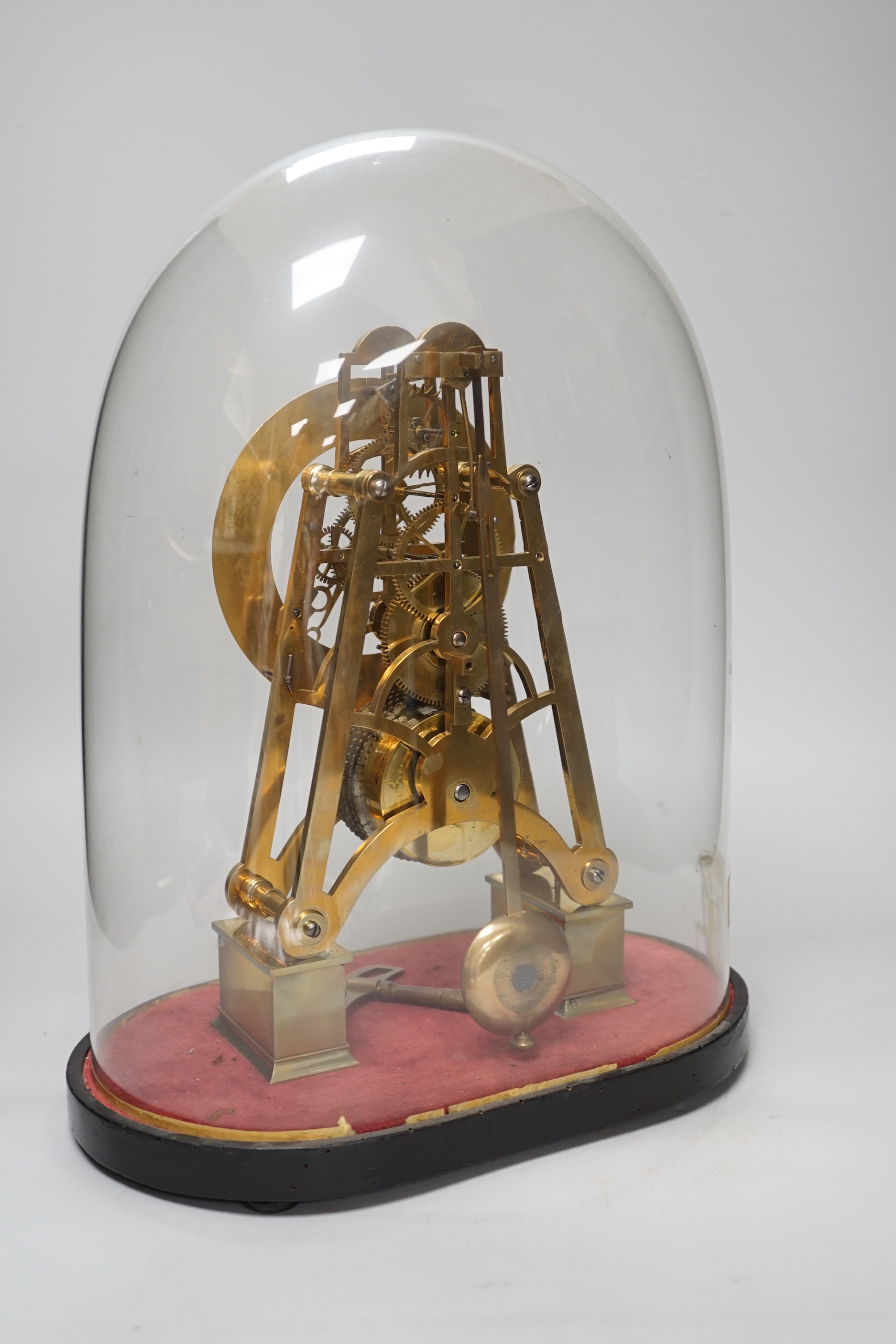 Simmons of London. A brass single fusee skeleton clock under dome, 38cm tall